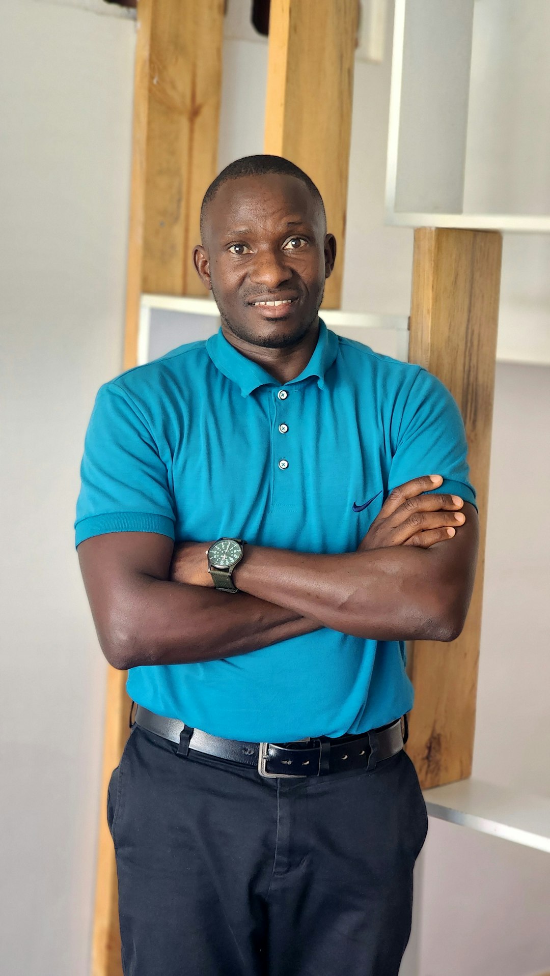 man-in-blue-polo-shirt-with-arms-crossed-xojv9kpkv4a